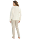 Woman wearing a white long-sleeve top and beige pants