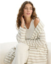 Woman wearing a striped beige and white robe