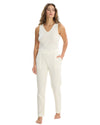 Woman wearing a white sleeveless top and pants