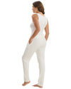 Woman wearing a white sleeveless top with matching pants
