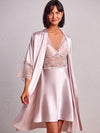 model wearing Short satin baby-doll robe in a soft pink color with hand-laced design on the front and plain back