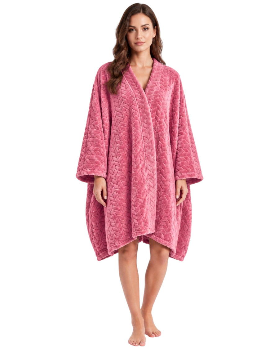 A woman modeling a pink textured robe with wide sleeves and a V-neckline