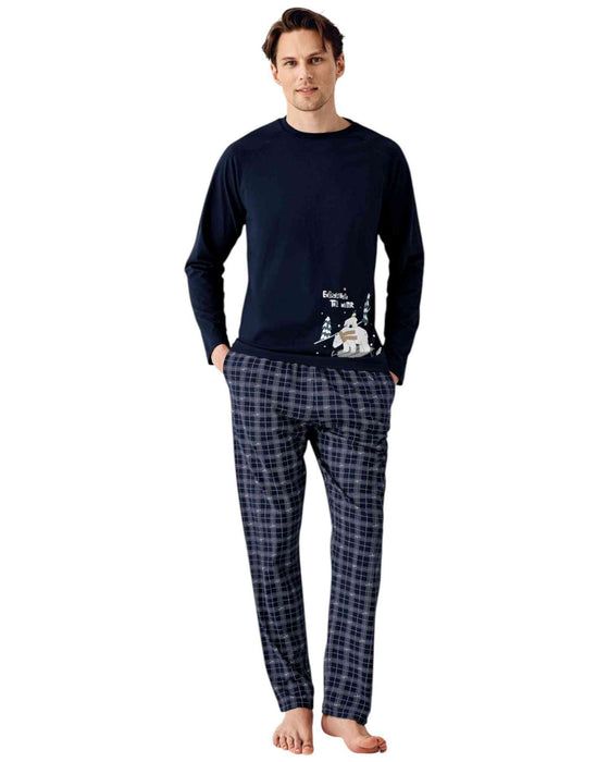 Man wearing a navy long-sleeve shirt and plaid pants