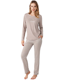  Woman wearing a long-sleeve top and striped pants 