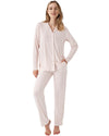 Woman wearing a light pink pajama set with mini dots