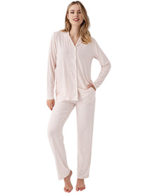  Woman wearing a light pink pajama set with mini dots