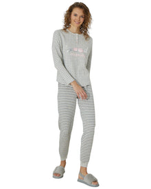  Woman wearing a gray pajama set with good morning print