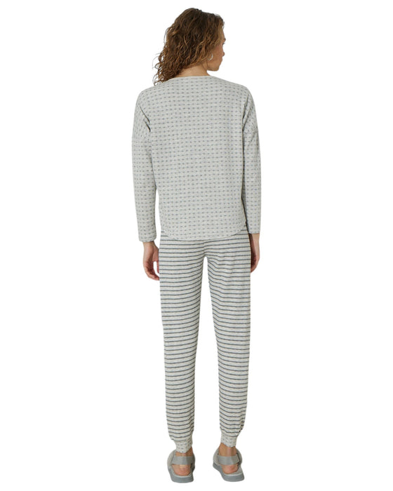 Woman wearing a gray pajama set 