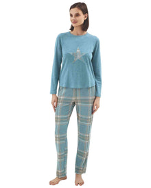  Woman wearing a blue long-sleeve top with a star design and plaid pants 