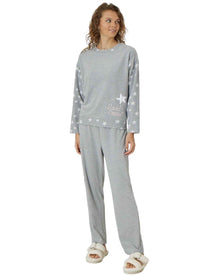  Woman wearing gray pajamas with star patterns 