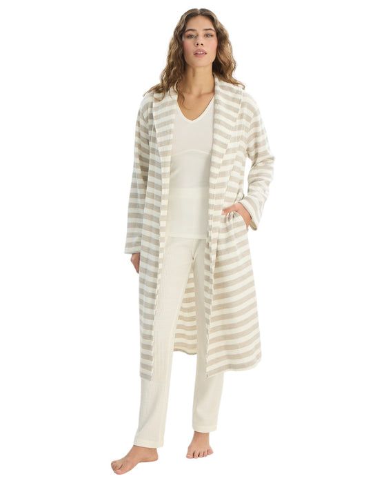Woman wearing a striped robe and pajama set 