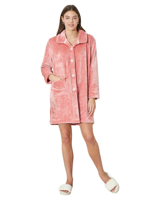 Woman wearing a pink plush robe 