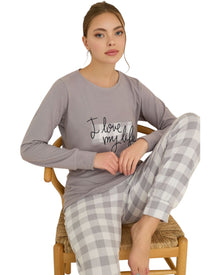  Woman wearing a lavender pajama set with 'I love my life' text