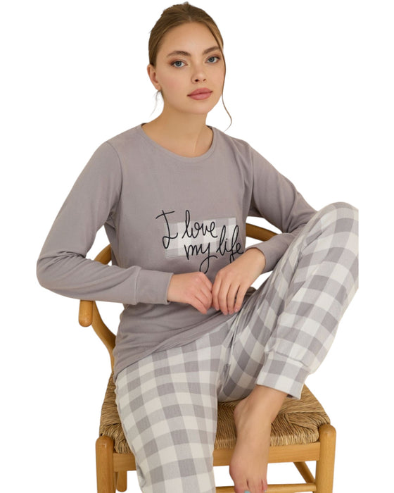 Woman wearing a lavender pajama set with 'I love my life' text