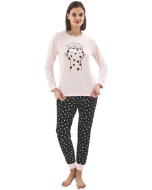  Woman wearing a pink long-sleeve top with cat print and black pants with hearts print 