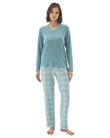  Woman wearing a teal long-sleeve top and plaid pants 