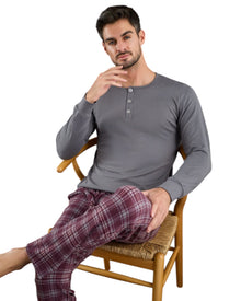  Man wearing a gray long-sleeve shirt and plaid pants 