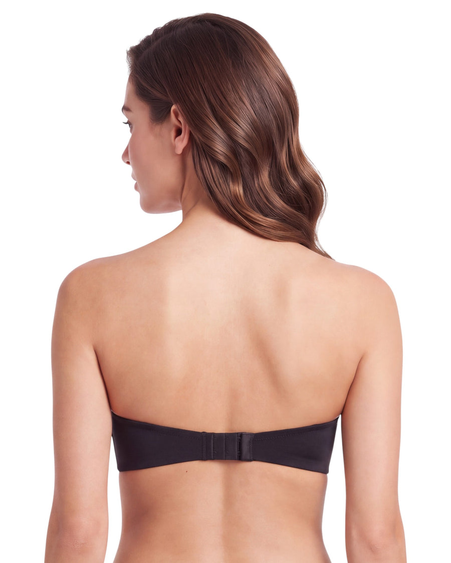 Back view of a woman wearing a black strapless push-up bra featuring a smooth back band and hook-and-eye closure