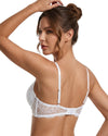 Woman wearing a white bralette with lace details 