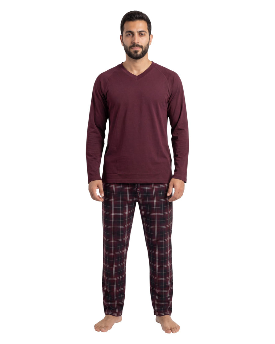 Man wearing a burgundy long-sleeve shirt and plaid pants