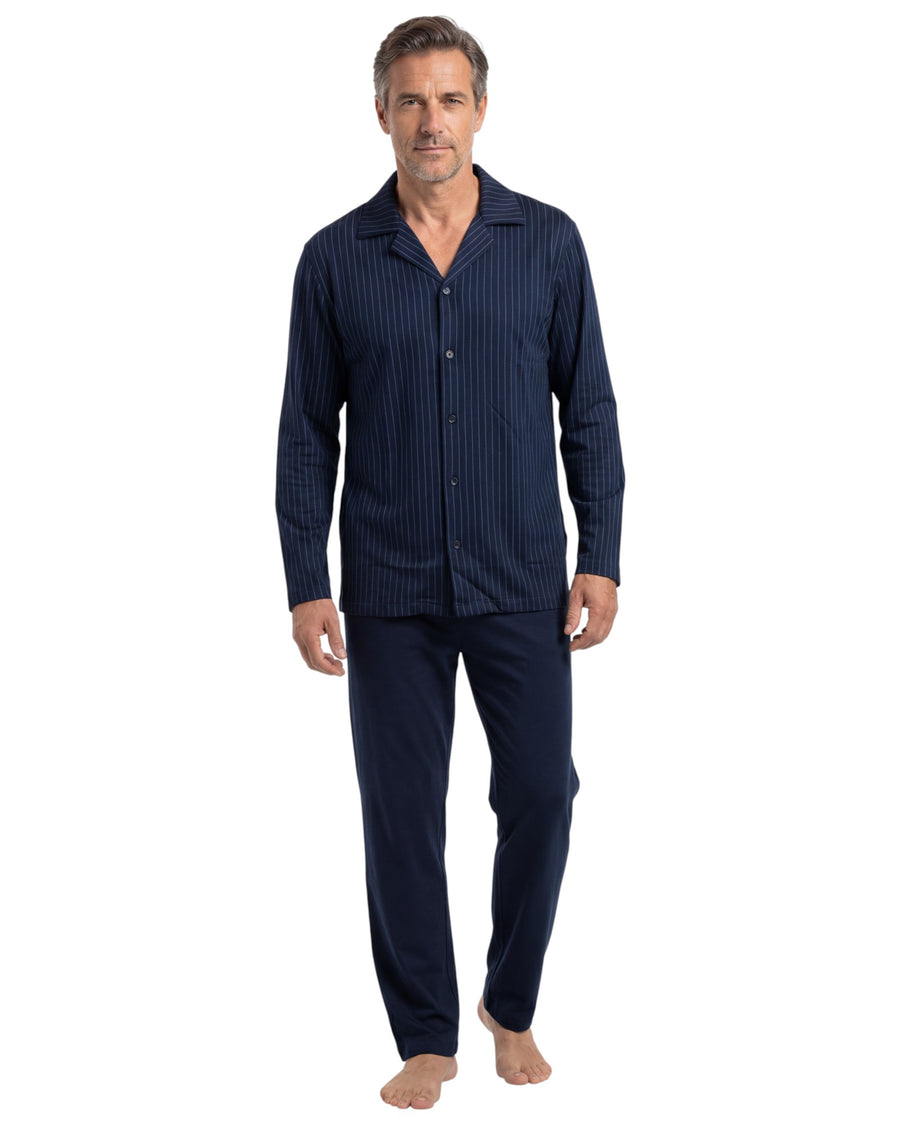 Man wearing a navy blue pajama set 