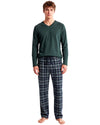 A man modeling a two-piece pajama set consisting of a dark green long-sleeve V-neck shirt and navy blue plaid pajama pants