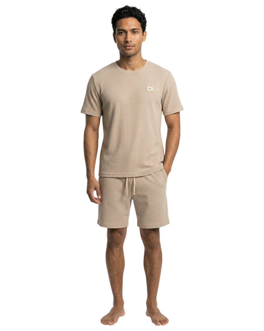 Man wearing a beige t-shirt and shorts set