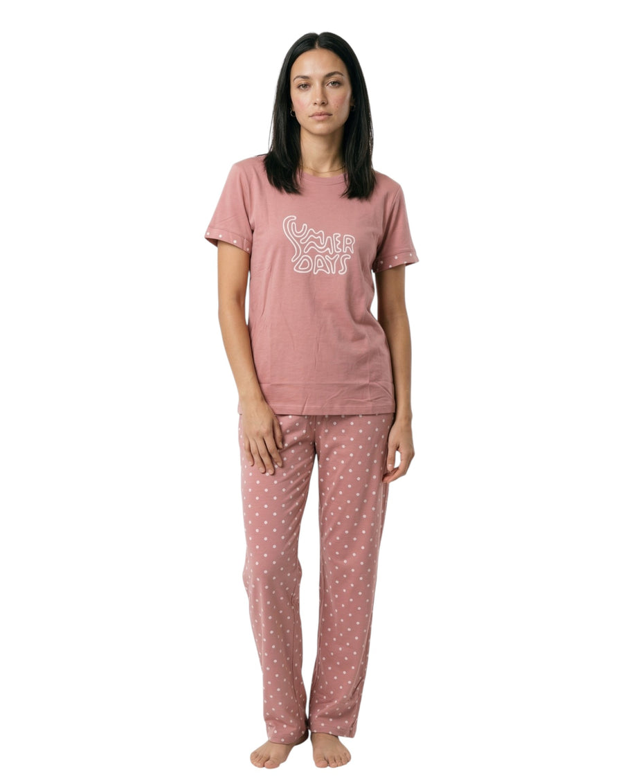 Woman wearing pink pajama set with Summer Days text