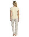 Woman wearing a yellow top and patterned pants