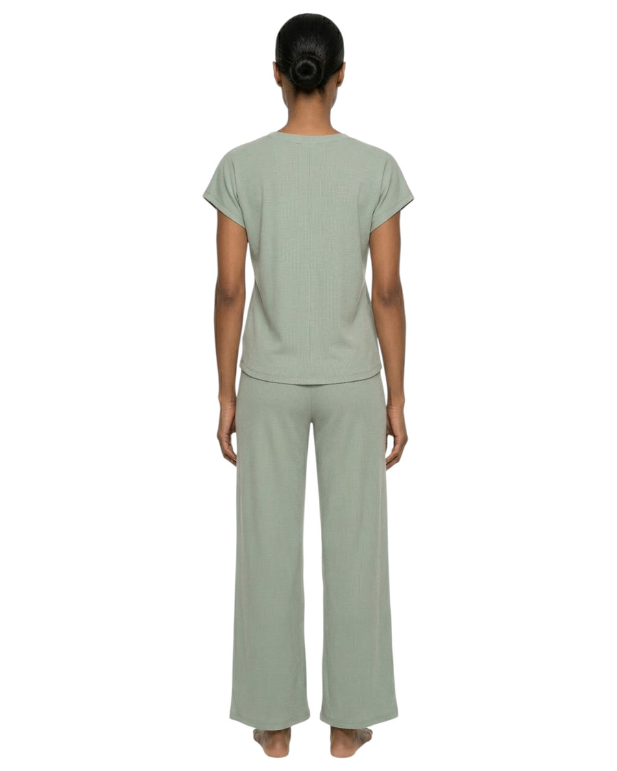 women wearg a soft olive long pajama set