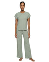 Woman wearing a soft olive long pajama set