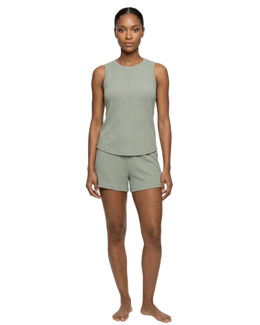 Woman wearing a green tank top and shorts set