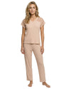 Woman wearing a nude blush pajama set 