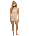 Woman wearing a nude blush tank top and shorts set with lace detail on the shoulders