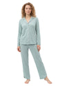 Woman wearing a light green pajama set long sleeve 
