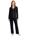 Woman wearing a black dots pajama set long sleeve 