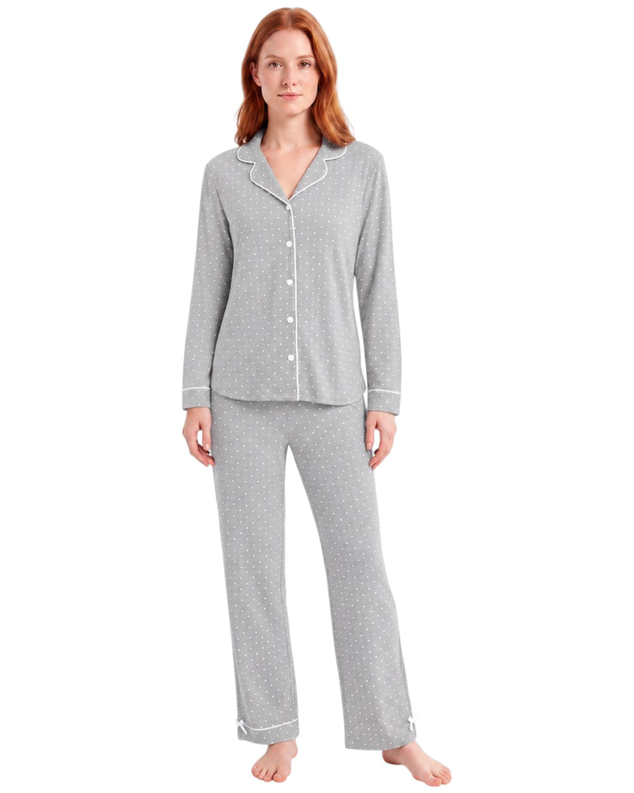 Woman wearing a grey dots pajama set long sleeve 