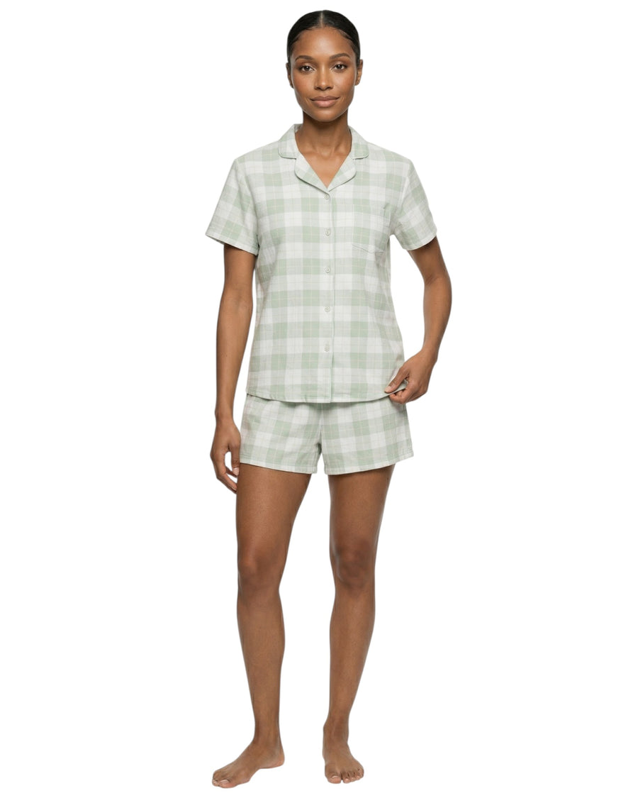 Woman wearing a green and white checkered shorts pajama set
