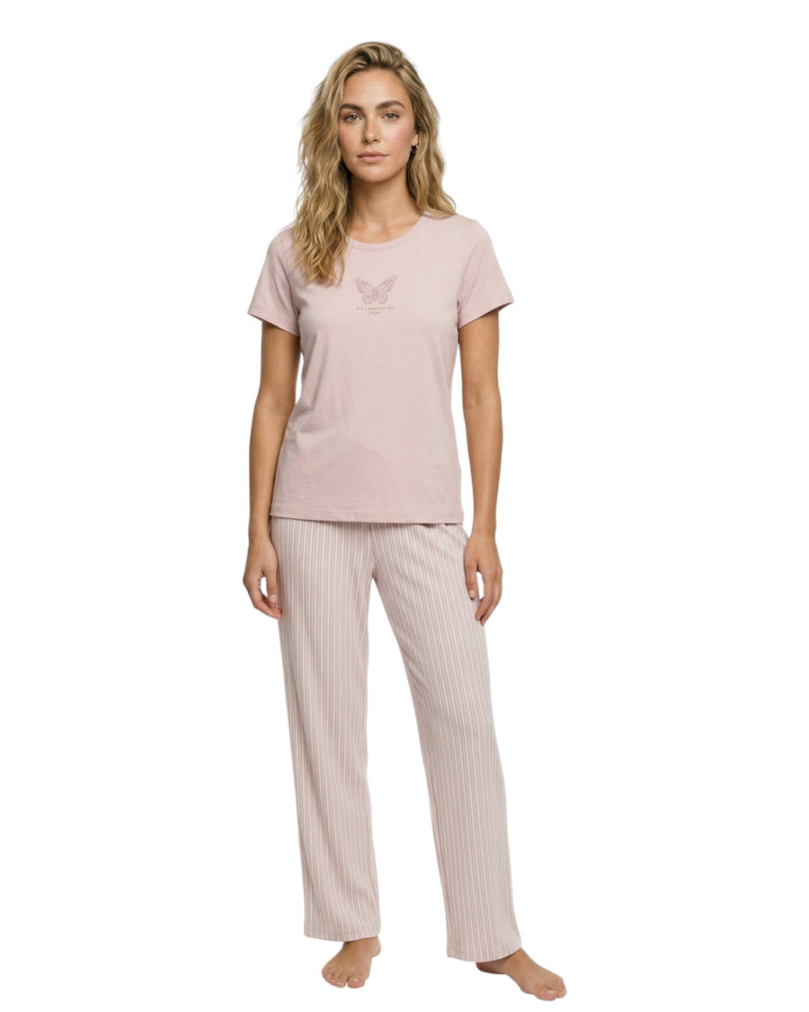 Woman wearing a pink t-shirt and striped pants 
