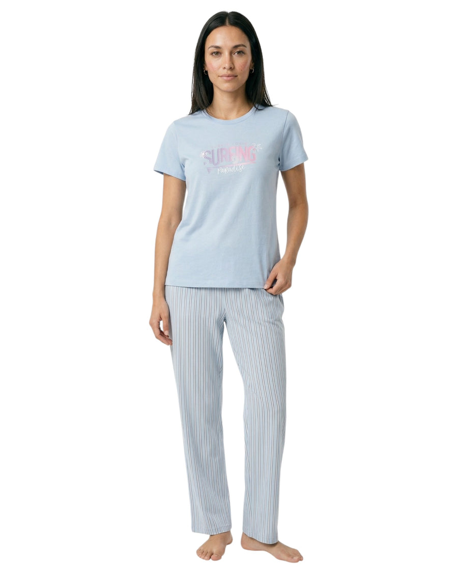 Woman wearing a light blue t-shirt and striped pants 