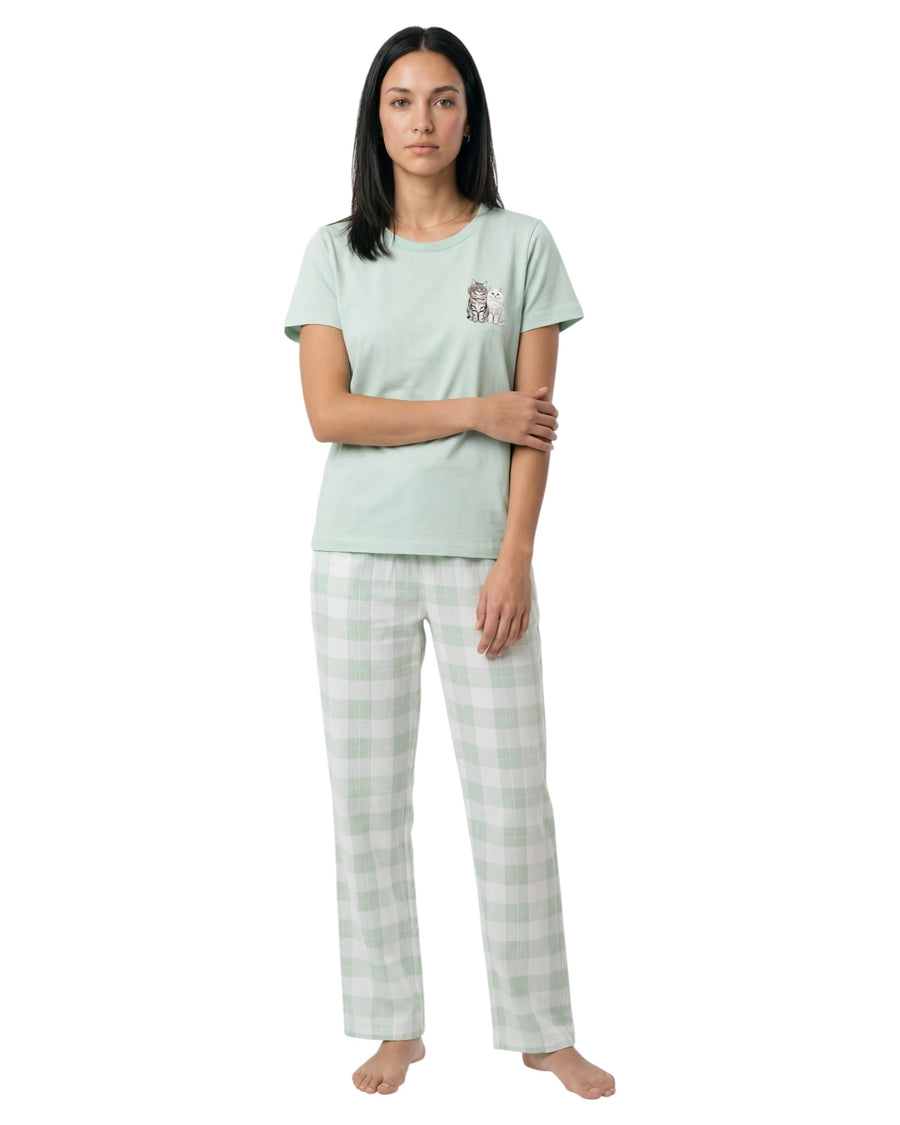 Woman wearing a light green t-shirt and checkered pants