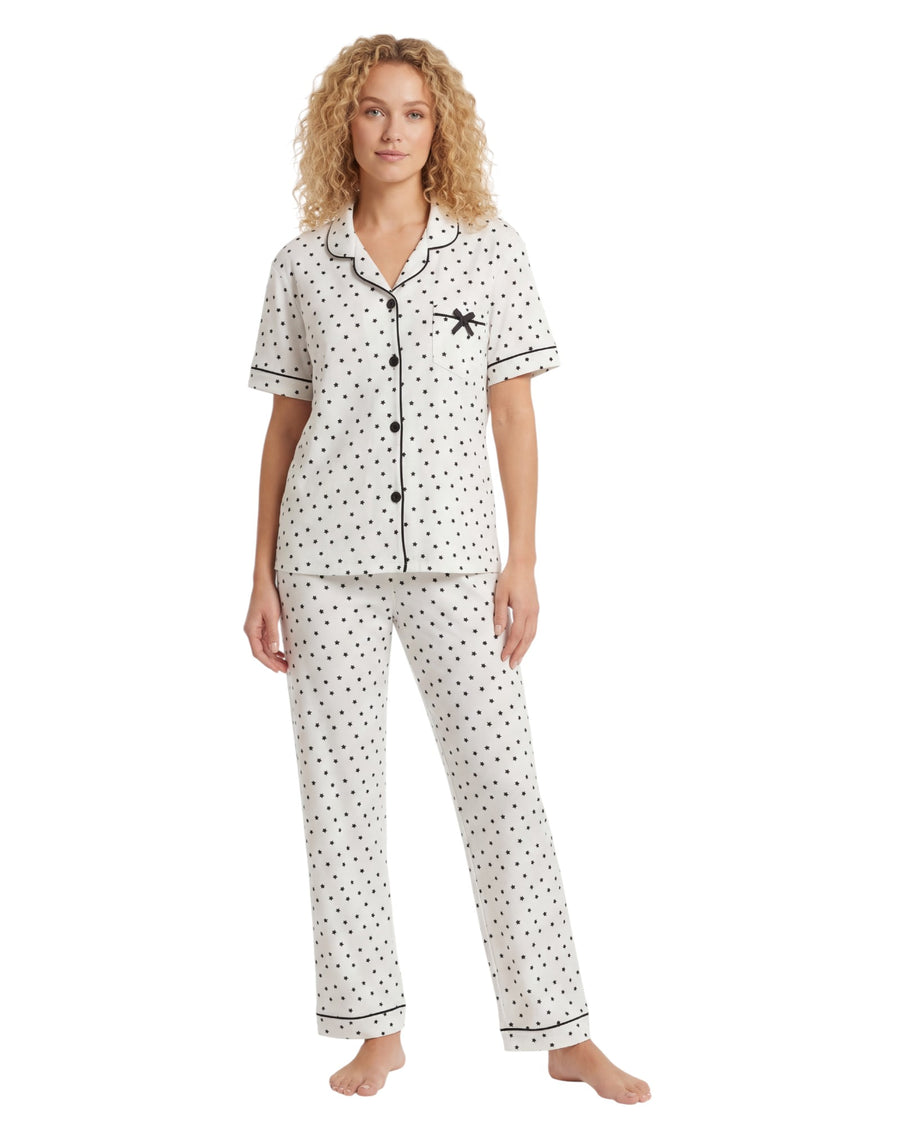 Woman wearing pajama set with all over star pajama set