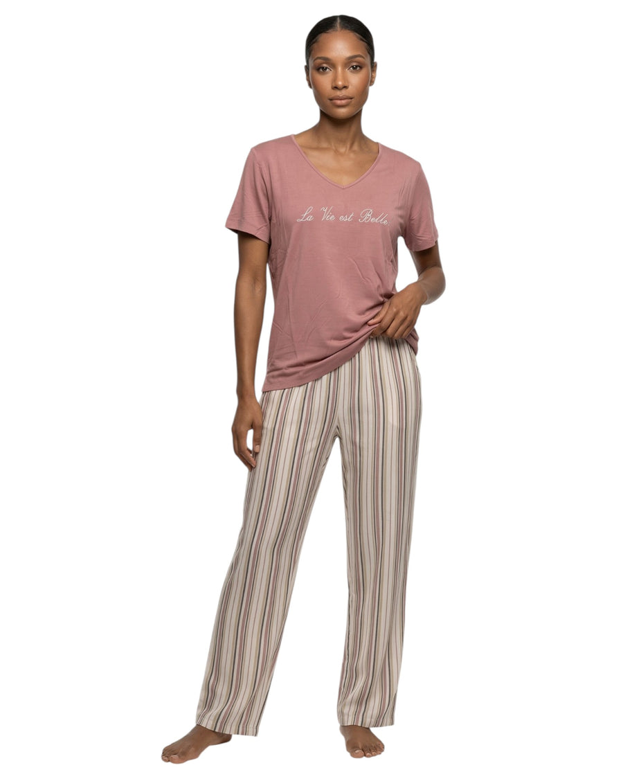 Woman wearing a pink t-shirt and striped pants