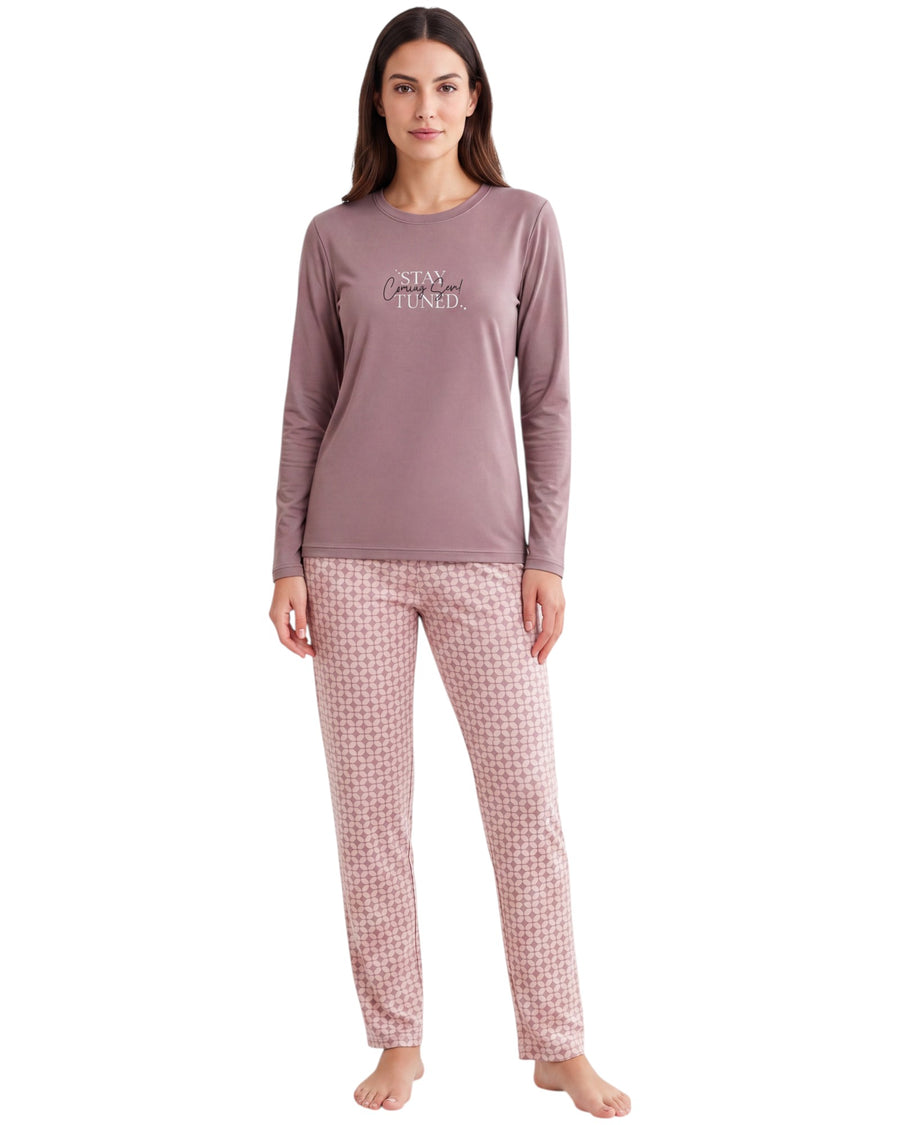 A woman modeling a two-piece pajama set consisting of a dusty mauve long-sleeve top with 'SLEEP WELL' printed on the chest and matching pink-and-white checkered pants