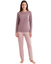 A woman modeling a two-piece pajama set consisting of a dusty mauve long-sleeve top with 'SLEEP WELL' printed on the chest and matching pink-and-white checkered pants