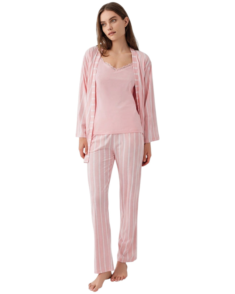 Woman wearing a pink pajama set with a matching cardigan 