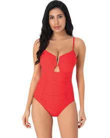  Model wearing a red one-piece swimsuit with plunging neckline, gold bar detail, front keyhole, and ruched waist
