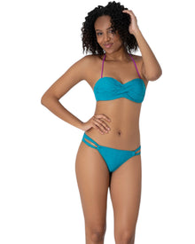  Model wearing a teal textured bandeau bikini with twist-front top, purple halter strap, and double-strap bikini bottoms
