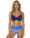 Woman wearing a blue printed high-waist bikini set with underwire bikini top, adjustable straps,