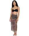 Model wearing a sheer leopard print beach cover-up with a wrap tie waist and side slit over black swimwear.